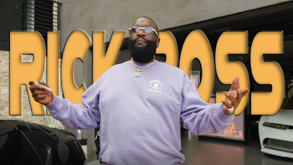 Rick Ross in a lavender sweatshirt with arms outstretched beside cars in a showroom, over gold title text
